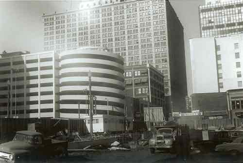 In this historic image, we see the Macy's garage in the background as the Kiener garages are built in the foreground.