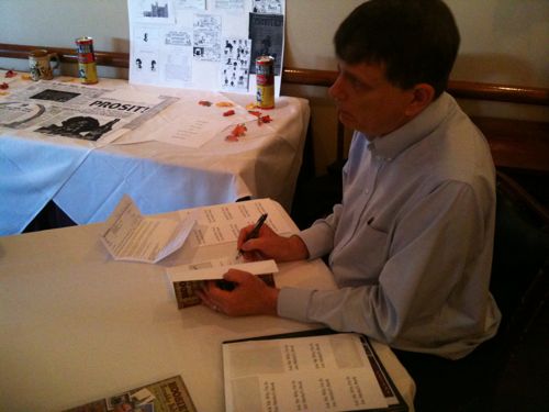 img_0428 ABOVE: Jim Merkel signs his new book