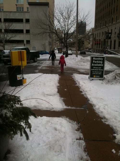 walking in snow ABOVE: Mother & daughter walking on Locust at 16th