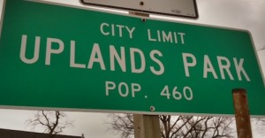 Sign on Natural Btidge marks the city limits of Uplands Park, population 460