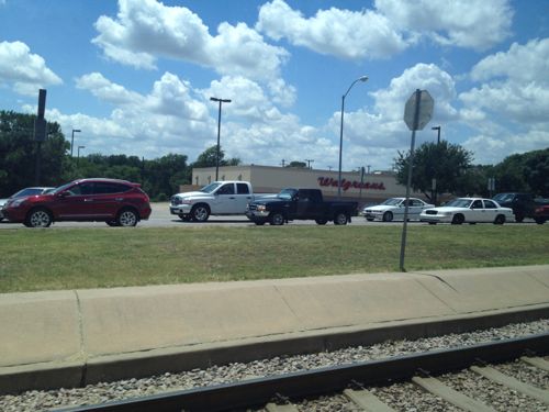 Dallas' South Blue Line light rail uses ballasted track in a wide median 