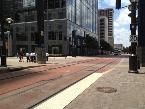 Light rail in downtown Dallas uses embedded track on Pacific Street where cars are banned. Emergency vehicles like fire, ambulance, police can use this street. In some cities cars are allowed to share these lanes. 