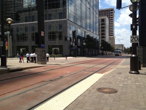 Light rail in downtown Dallas uses embedded track on Pacific Street where cars are banned. Emergency vehicles like fire, ambulance, police can use this street. In some cities cars are allowed to share these lanes.