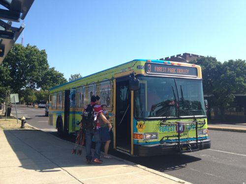 2012: People board the Forest Park Trolley to visit the park