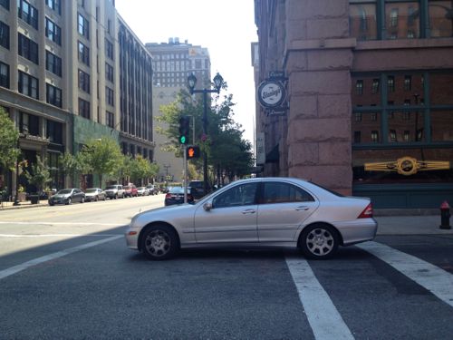 ABOVE: A NB motorist technically ran the light by stopping past the stop line. July 2012