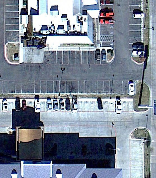 ABOVE: Aerial view with the Holiday Inn Express on bottom facing the back of the Texas Roadhouse on top