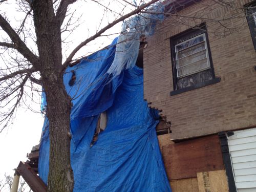 ABOVE: The corner of one building is collapsing 