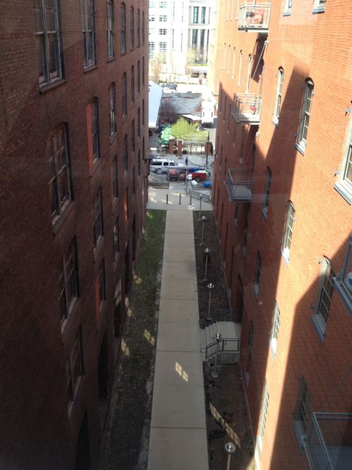 The narrow walkway between the buildings is now closed.