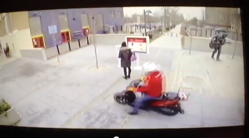 Screenshot from McDonald's commercial showing a scooter delivering food on the sidewalk. Click image to view commercial in YouTube.  