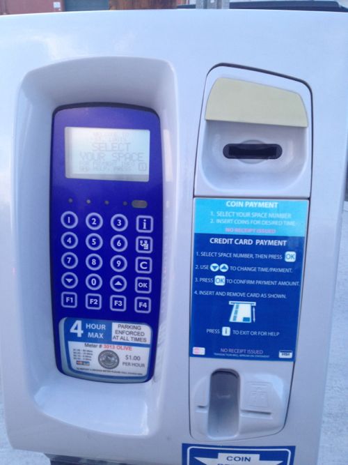 The pay-per-space machine accepts coins and credit cards, but not bills.  