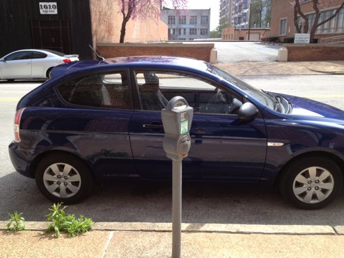 This driver managed to center their car on the meter, halfway in two parking spaces.