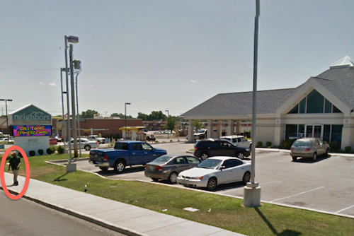 Pedestrian in front of Neighbors Credit Union 