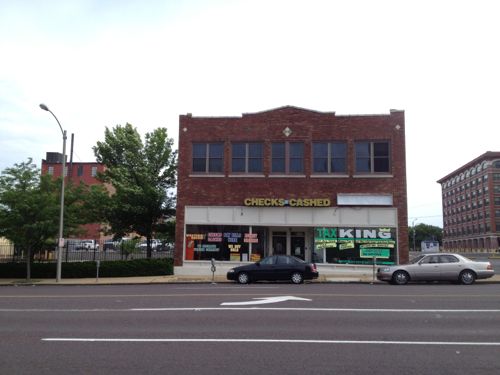 The Currency Exchange owns the building at 1809 Olive, it has no parking despite being surrounded by parking. 