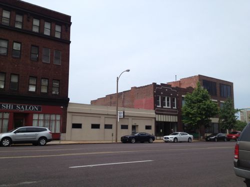 Four buildings, four owners. Three from 19th century, one 20th century. The beige one-story building is from 1896! 