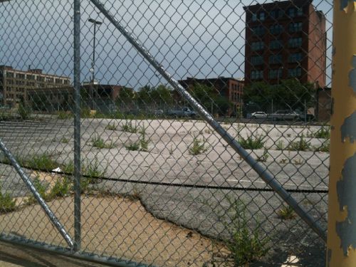 The block bounded by Olive, Pine, 21st, & 22nd, was cleared for the unbuilt 22nd Street Parkway.  21st & 22nd were vacated, these should be reopened.