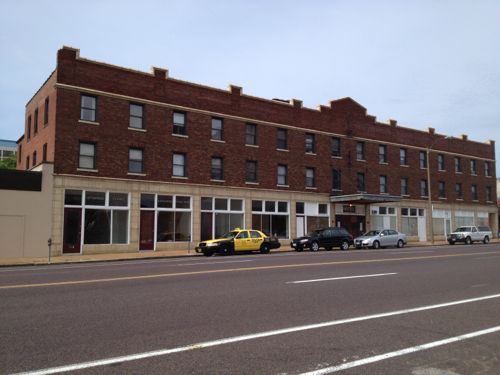 The Lincoln Arms Hotel provides low rent rooms by the week, serving a need. But walk by in the summer and the smell is awful. The physical form is ideal along a streetcar line.