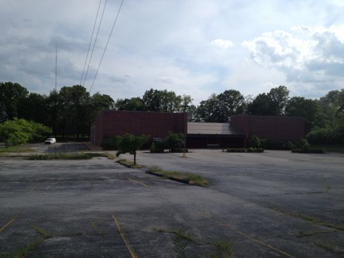 The now-closed Kenrick Cinema is located on the west side of Trianon Parkway.