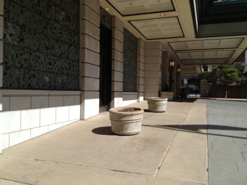 Two simple planters tell motorists this isn't a parking space.  