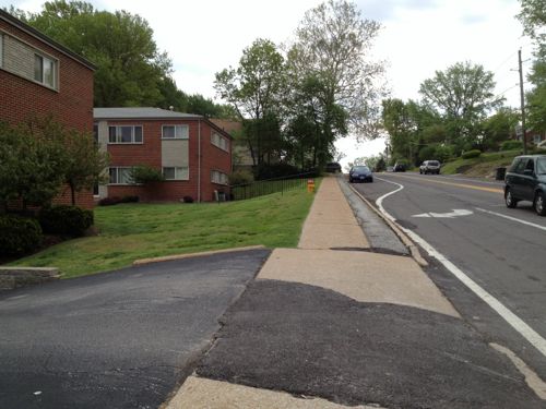 The north side of Murdoch has a sidewalk next to the apartment buildings only.