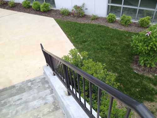 A route was provided for pedestrians to enter the building, but it contains a flight of stairs. No ramp was provided as required by the ADA.