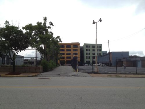 Across the street is more AT&T parking on the left. Loft apartments on Washington Ave can be seen in the background. 