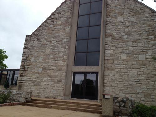 The central glass on the front of this church always looked too modern but I never knew the story.