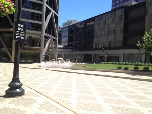 A few years ago the owner of the US Bank tower considered building a parking garage to replace this useless plaza. Hopefully an occupied building will replace the plaza. The Ambassador Theater was razed in 1996 for the plaza, click for info. 