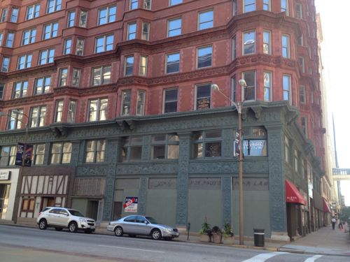 Diagonally across the intersection is the Chemical Building . Click the image to read about development plans  for this building. Retail will be more viable once the streetcar line opens.