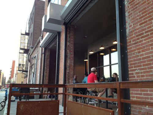 The patio and recessed glass wall are inviting