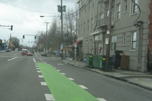 The places where cars are allowed to cross bike lanes for right turns are very clear in Portland OR.