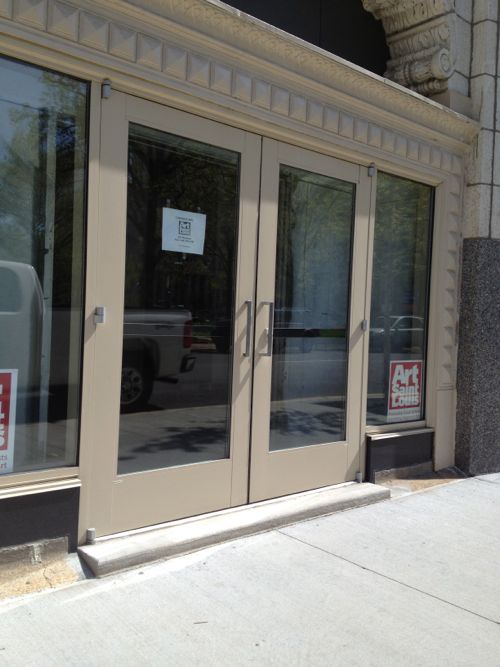 I snapped this shot in late April showing the step into the retail space. New door, new step, new sidewalk -- all from 2011. 