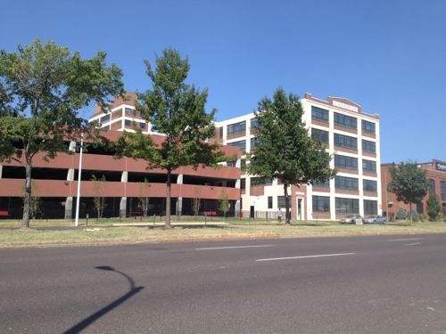 A former warehouse facing Forest Park and another facing Laclede are apartments geared toward SLU students. The parking garage was set back enough to permit a shallow liner building. 