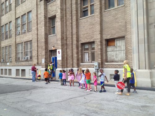 Students return to Lafayette Preparatory Academy from outdoor time at Lucas Park's playground, August 2013 photo