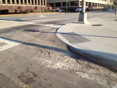Asphalt was the solution, but this isn't ADA-compliant. In such a major project I see no valid excuse. This was either poor planning or execution.