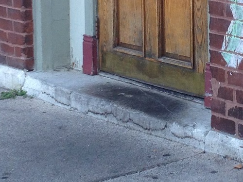 This door is unlocked and also used as an entrance, the step makes it impossible to enter