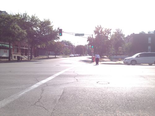 A female pedestrian makes her way across Jefferson at Russell