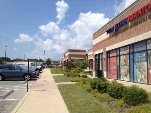 The businesses front the surface parking lot  