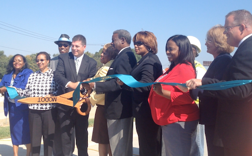 Officials cut the ribbon opening the off ramp from I-70 onto the new Tucker.   
