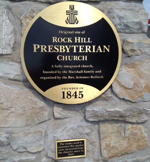 Close up of the plaques on the stone monument