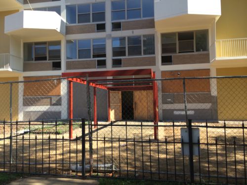 The apartment building entry is getting rebuilt, it faces the Centenary parking lot 