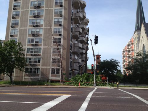 Sometime after May 2011 pedestrian signals were installed and a single crosswalk was painted on the east side of 16th. In this picture the new owner of the building on the left was cutting down old trees, blocking the narrow walkway. 