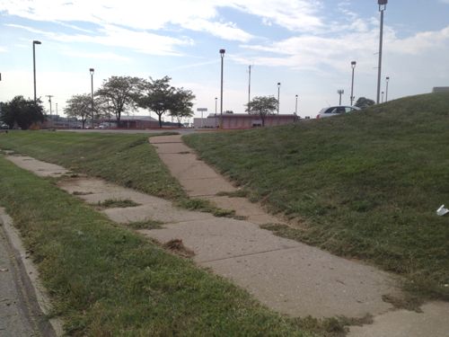 The sidewalks connecting the houses to the commercial remain.