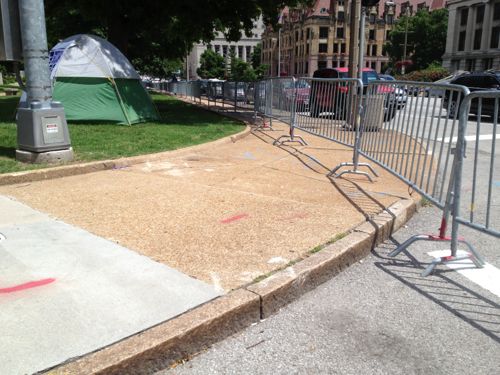 The problem with holding events in an area not designed for events is crowd control and accessibility. Here crowd control blocks access to the curb ramps