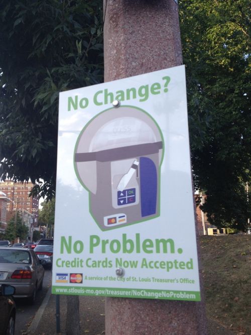 A sign facing Euclid near Lindell highlighting the fact these meters accept credit card payments.  