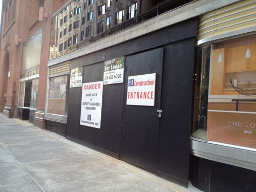 In March I was worried when I saw the plywood up at the entrance to the main Art Deco storefront. But perhaps it was just to protect  the vitrolite and curved glass...   