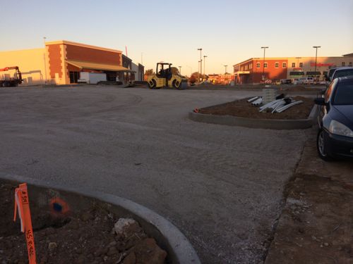 The concrete curbs between the parking lot and Soulard St are already poured, no provisions for ramps, sidewalk