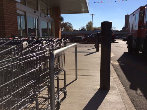 Who fits between the carts & bollard? Certainly nobody using a cane, walker, scooter, or wheelchair! #adafail