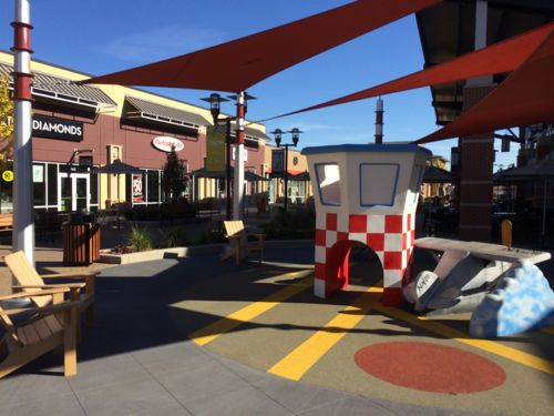 A children's playground is next to the food court in the center