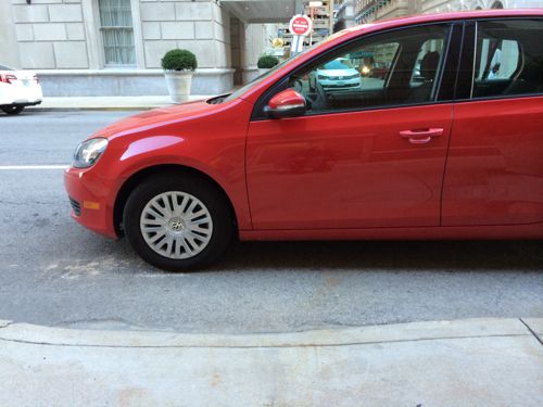 November 4th a VW Golf is parked blocking the ramp to cross 9th at St. Charles St. 