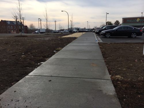 A new sidewalk connects to the public sidewalk along Lafayete, something I didn't see on my prior site visit. 